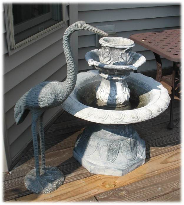 Outdoor crane figurine on deck